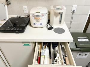 Een keuken of kitchenette bij Marina Bay Atami