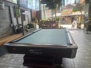 a pool table sitting in the middle of a street at Outland Hostel Vang Vieng in Vang Vieng