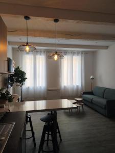 a living room with a table and a couch at Bon Pasteur in Aix-en-Provence