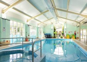 a large swimming pool in a large room at Cresswell Towers in Morpeth