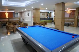 a pool table in a hotel room with a pool table at Gamyoungroo Hanok Hotel in Jeonju
