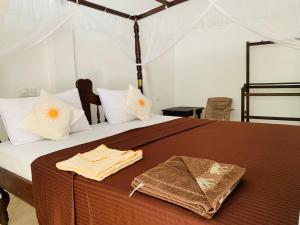 Katil atau katil-katil dalam bilik di Soorya Guest Mirissa