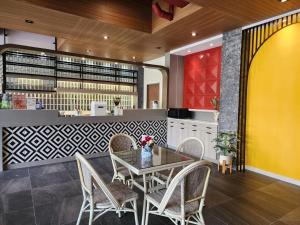 a dining room with a table and chairs at Penpark Place in Bangkok