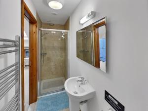 a bathroom with a sink and a shower at Lane End Cottage North Molton in North Molton +22 photos