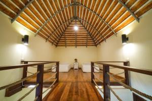 a large room with a wooden floor and a vaulted ceiling at Nangyuan Island Dive Resort in Ko Tao