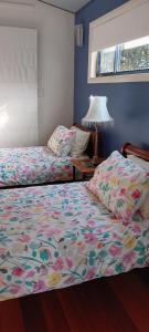 Postel nebo postele na pokoji v ubytování Beachfront Seagulls on Shoalhaven