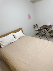 Voodi või voodid majutusasutuse Residence天王寺東 toas