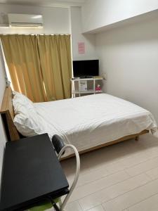 TV a/nebo společenská místnost v ubytování Residence天王寺東