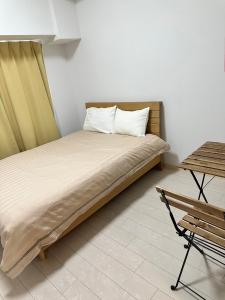 Voodi või voodid majutusasutuse Residence天王寺東 toas