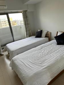 Voodi või voodid majutusasutuse Residence天王寺東 toas