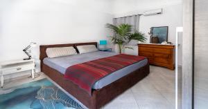 Ένα ή περισσότερα κρεβάτια σε δωμάτιο στο Casa terrazza esclusiva Wi-Fi- Air Conditioning - centro storico