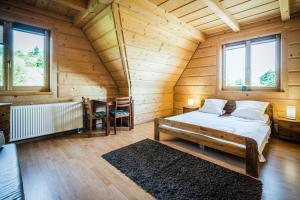 Postel nebo postele na pokoji v ubytování VisitZakopane - Willa Karina