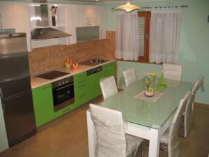 A kitchen or kitchenette at Dražen Apartment