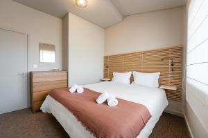 Ένα ή περισσότερα κρεβάτια σε δωμάτιο στο GuestReady - A charming duplex home near Boavista