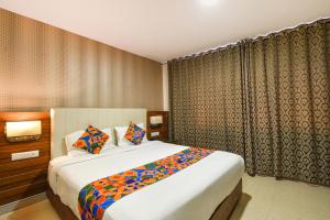 Giường trong phòng chung tại Oriva Millennium Grand