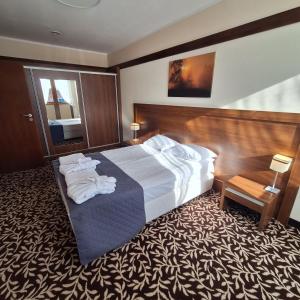 Posteľ alebo postele v izbe v ubytovaní Hotel i Aquapark Olender