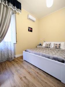 Postel nebo postele na pokoji v ubytování Al Quadrato D'Oro rooms