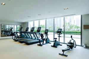 a gym with treadmills and elliptical machines at Burj Crown Luxury 4 Bedroom, Balcony Views, 5 min to Burj Khalifa in Dubai +95 photos