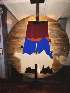 a large wooden table with a painting on it at The Click Clack Hotel Bogotá in Bogotá