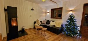 Posezení v ubytování Chalet Alpl - Ferienwohnung Waldblick mit Sauna, Kamin & Whirlwanne + 13 fotografií