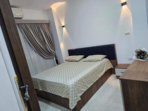 Postel nebo postele na pokoji v ubytování Hurghada red ruby