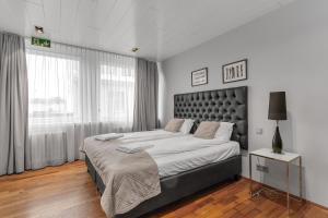 Ένα ή περισσότερα κρεβάτια σε δωμάτιο στο Midtown Hotel