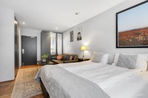 Ένα ή περισσότερα κρεβάτια σε δωμάτιο στο Midtown Hotel