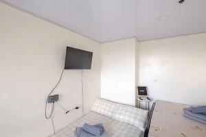 Μια τηλεόραση ή/και κέντρο ψυχαγωγίας στο Minimalist Loft 107