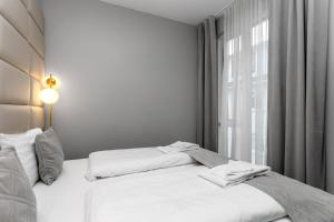 Ένα ή περισσότερα κρεβάτια σε δωμάτιο στο Midtown Hotel
