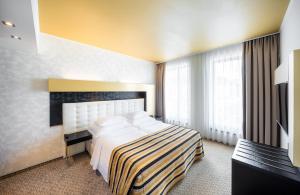 Postel nebo postele na pokoji v ubytování Grandior Hotel Prague