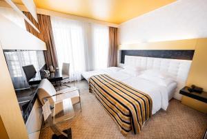 Postel nebo postele na pokoji v ubytování Grandior Hotel Prague