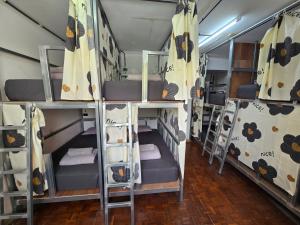 a group of bunk beds in a room at Panda Lodge Home Stay in Bangkok +44 photos