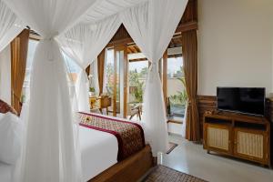 Televisyen dan/atau pusat hiburan di Sadhaka Ubud Villa