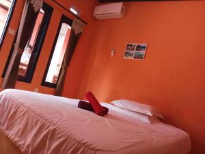 Perwita Homestay客房内的一张或多张床位