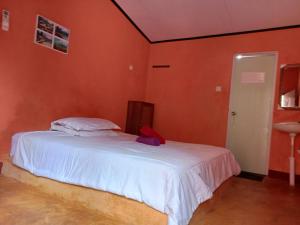 Perwita Homestay客房内的一张或多张床位