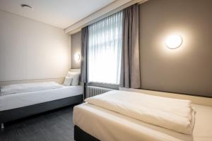Postel nebo postele na pokoji v ubytování Kassel Ost