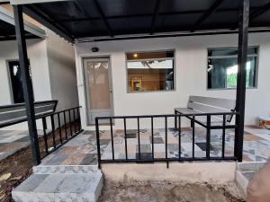 a porch of a house with a bench at Slumberland at Pai in Pai
