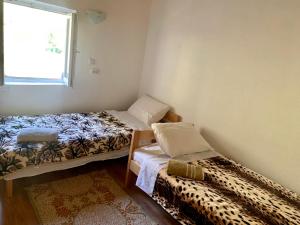 Postel nebo postele na pokoji v ubytování Sofia Guest House