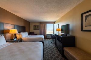 a hotel room with two beds and a television at Crowne Plaza Newark Airport by IHG in Elizabeth +37 photos