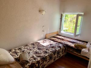Postel nebo postele na pokoji v ubytování Sofia Guest House