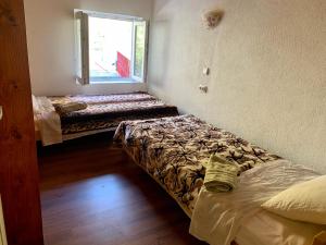 Postel nebo postele na pokoji v ubytování Sofia Guest House