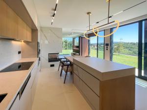a kitchen with a large island with a table and chairs at Beykoz Breeze in Beykoz