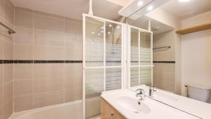 a bathroom with a sink and a shower at Residence les Pleiades in Flaine +55 photos