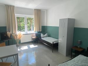a living room with a couch and a window at A2rooms in Lehnin +10 photos