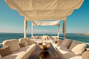a couch on a boat with the ocean in the background at Radisson Blu Resort & Spa in Split