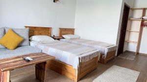 Postel nebo postele na pokoji v ubytování hakuna matata