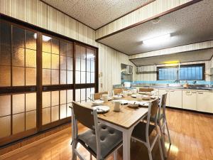 a dining room with a wooden table and chairs at #12 Sekigahara Hotaru in Sekigahara