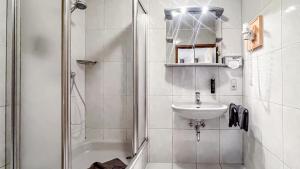 a white bathroom with a sink and a shower at Smart Resorts B&B1 BB1 118 in Winterberg +36 photos
