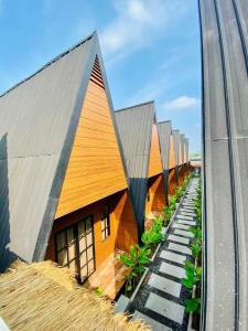 an overhead view of a building with wooden roofs at D'svarga Glamping in Seturan