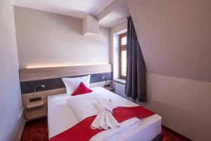 Postel nebo postele na pokoji v ubytování Hotel Lengenfelder Hof